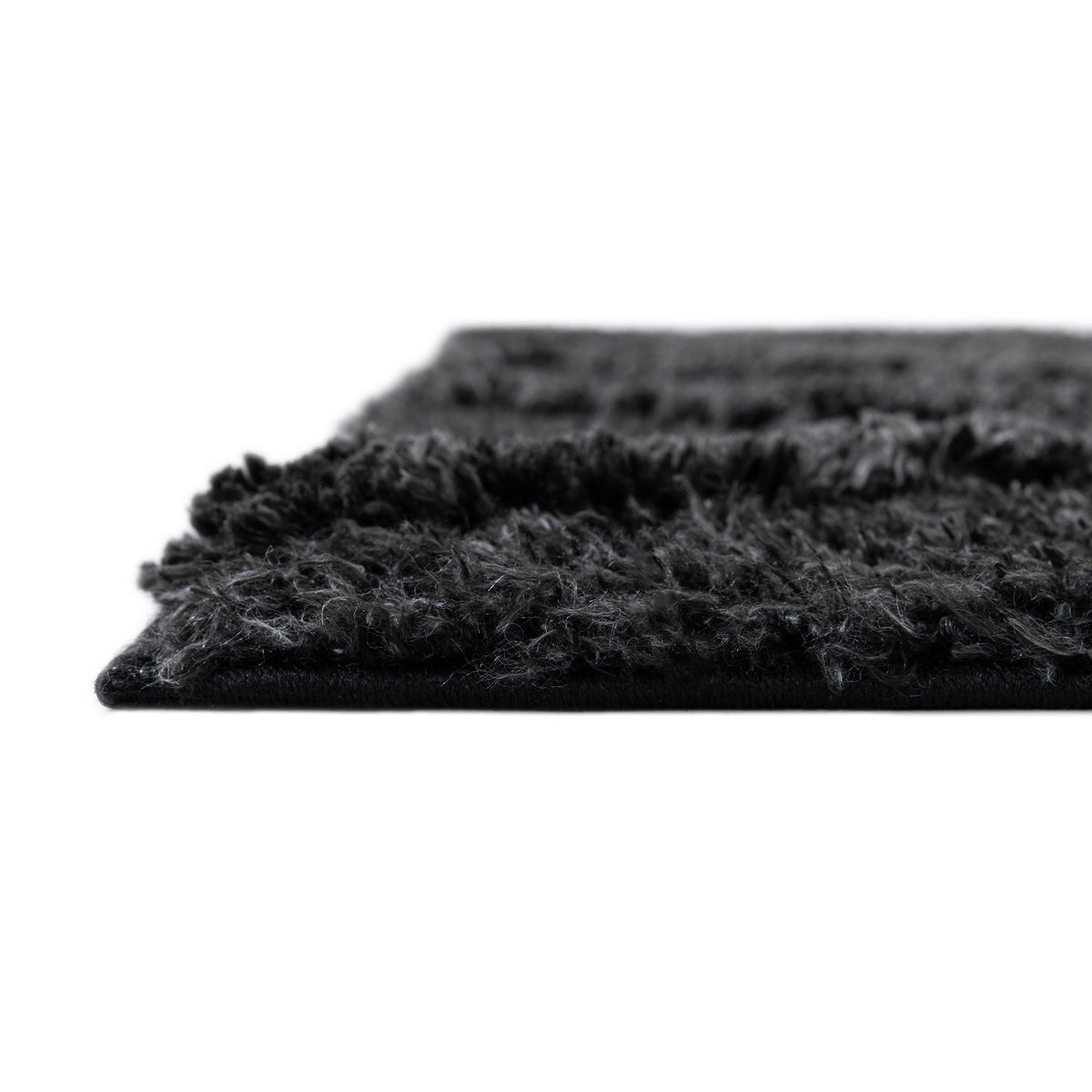 Rechteck Teppich Thun Tribus in Schwarz von Hadorn™ - Lifestyle Image