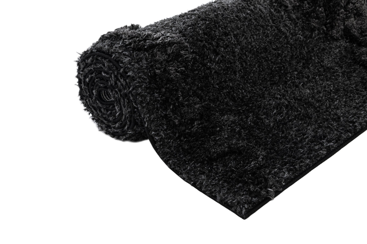 Rechteck Teppich Thun Scutum in Schwarz von Hadorn™ - Lifestyle Image