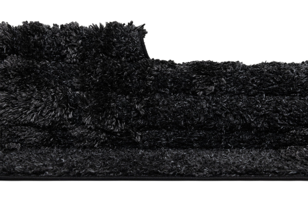 Rechteck Teppich Thun Scutum in Schwarz von Hadorn™ - Lifestyle Image